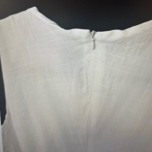 Lillusory white lacy sleeveless dress with circular cutouts each side at waist - Picture 6 of 6